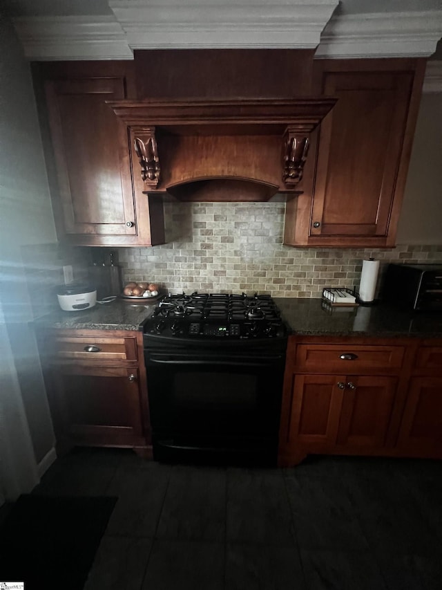 9 Lee St, Liberty, SC 29657 - kitchen featuring black gas stove, custom exhaust hood, tasteful backsplash, ornamental molding, and brown cabinetry