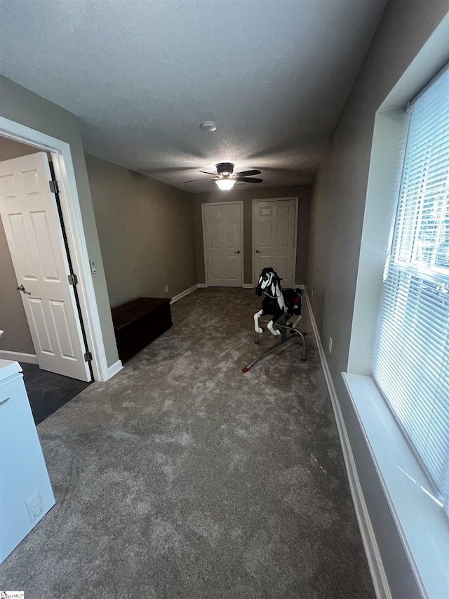 9 Lee St, Liberty, SC 29657 - unfurnished living room with ceiling fan, carpet, baseboards, and a textured ceiling