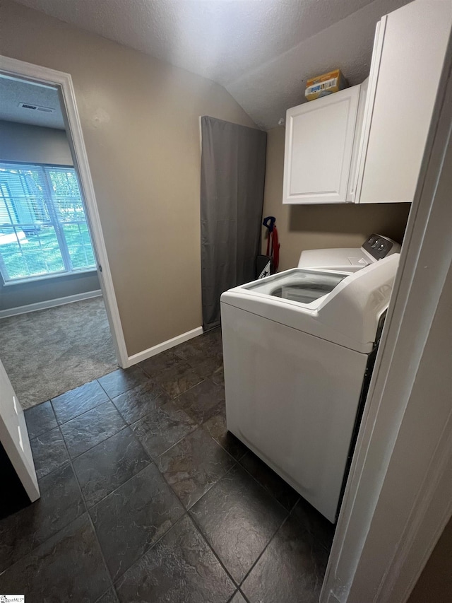 9 Lee St, Liberty, SC 29657 - laundry room with cabinet space, baseboards, stone tile flooring, and washing machine and dryer