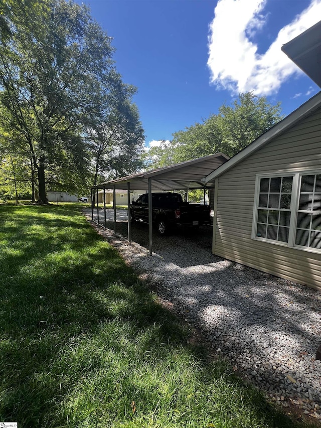 9 Lee St, Liberty, SC 29657 - view of car parking with gravel driveway and an attached carport