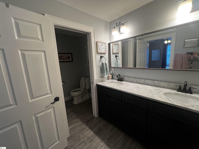 9 Lee St, Liberty, SC 29657 - full bath featuring double vanity, toilet, and wood finish floors