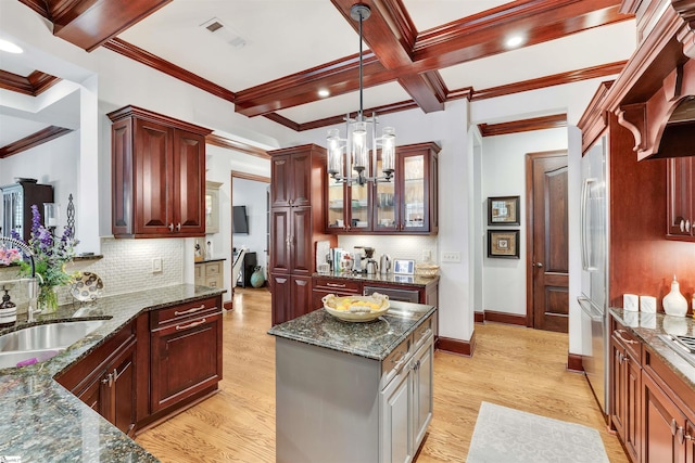172 Ridgeland Dr # 101, Greenville, SC 29601 - kitchen with a sink, beamed ceiling, a chandelier, decorative light fixtures, and dark brown cabinets