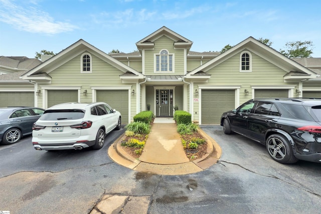 172 Ridgeland Dr # 101, Greenville, SC 29601 - view of property featuring driveway, a standing seam roof, and an attached garage