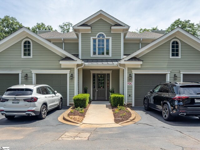 172 Ridgeland Dr # 101, Greenville, SC 29601 - view of front of house featuring a shingled roof, driveway, and a garage
