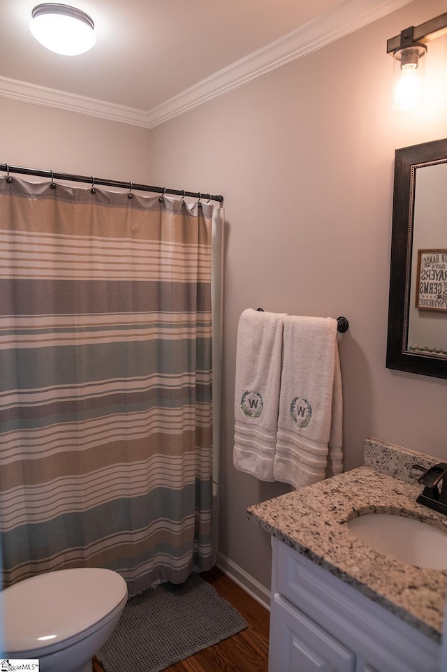 113 Hardy St, Williamston, SC 29697 - full bathroom featuring vanity, wood finished floors, crown molding, toilet, and baseboards
