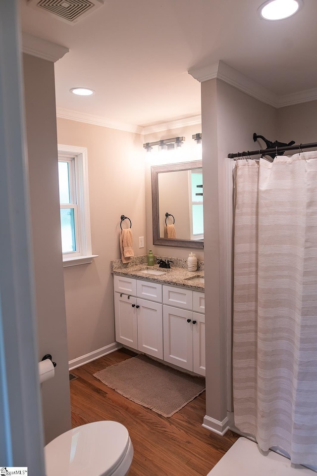 113 Hardy St, Williamston, SC 29697 - full bath with toilet, vanity, ornamental molding, wood finished floors, and curtained shower