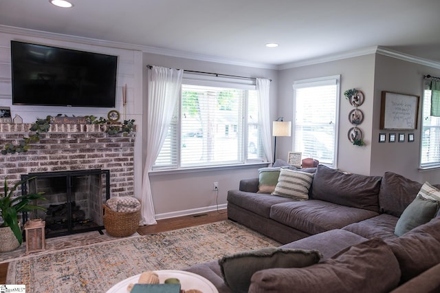 113 Hardy St, Williamston, SC 29697 - living room with wood finished floors, baseboards, ornamental molding, a fireplace, and recessed lighting