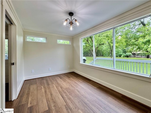 800 Holiday Dam Rd, Honea Path, SC 29654 - unfurnished room with baseboards, wood finished floors, a chandelier, and ornamental molding