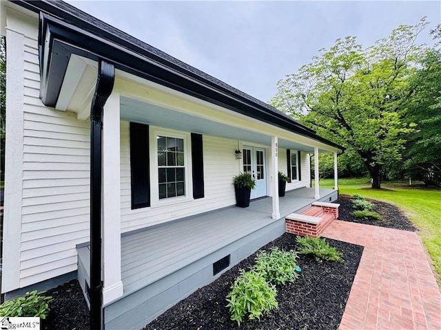 800 Holiday Dam Rd, Honea Path, SC 29654 - view of property exterior featuring covered porch, french doors, and crawl space