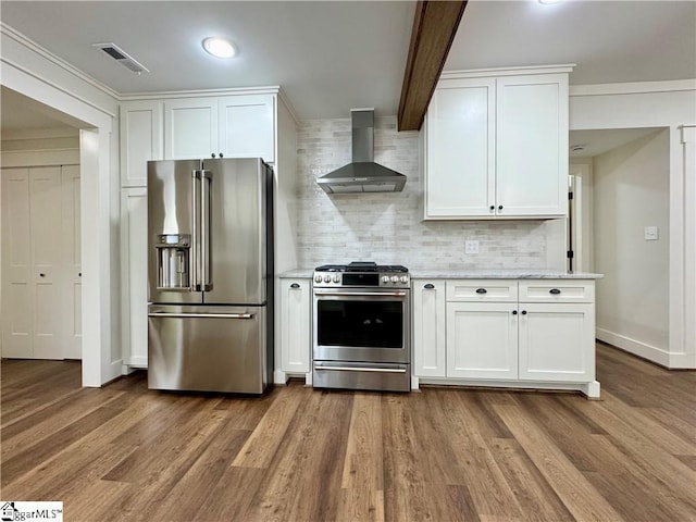 800 Holiday Dam Rd, Honea Path, SC 29654 - kitchen featuring stainless steel appliances, wall chimney exhaust hood, backsplash, dark wood-style flooring, and white cabinets