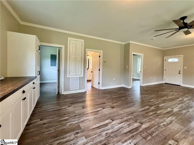 800 Holiday Dam Rd, Honea Path, SC 29654 - unfurnished living room featuring dark wood-style flooring, ceiling fan, ornamental molding, and baseboards