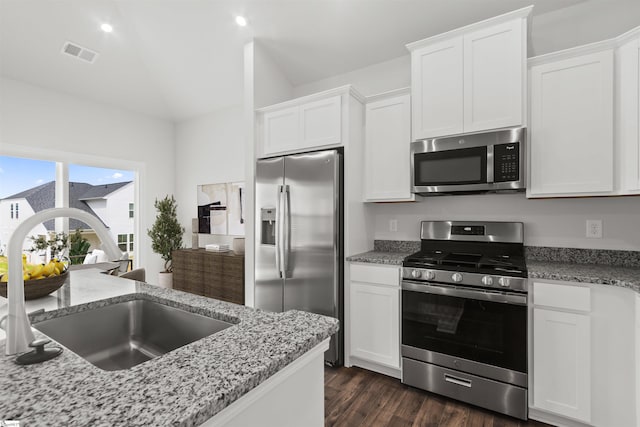 1142 Berry Patch Dr, Lyman, SC 29365 - kitchen with appliances with stainless steel finishes, a sink, white cabinets, dark wood-type flooring, and light stone countertops
