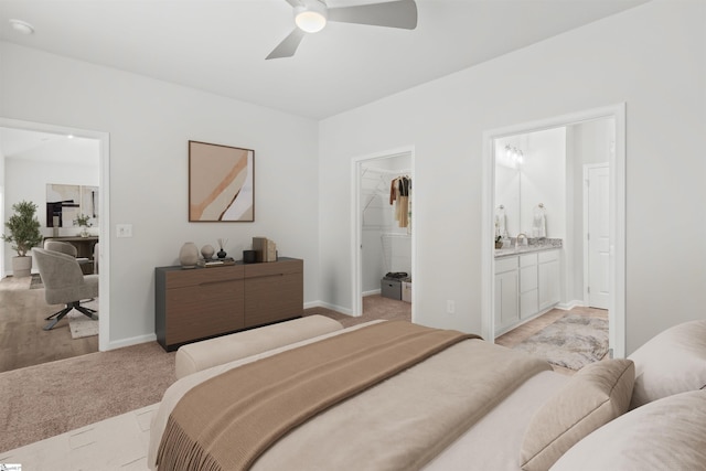 1142 Berry Patch Dr, Lyman, SC 29365 - bedroom featuring a spacious closet, ensuite bathroom, ceiling fan, light colored carpet, and a closet