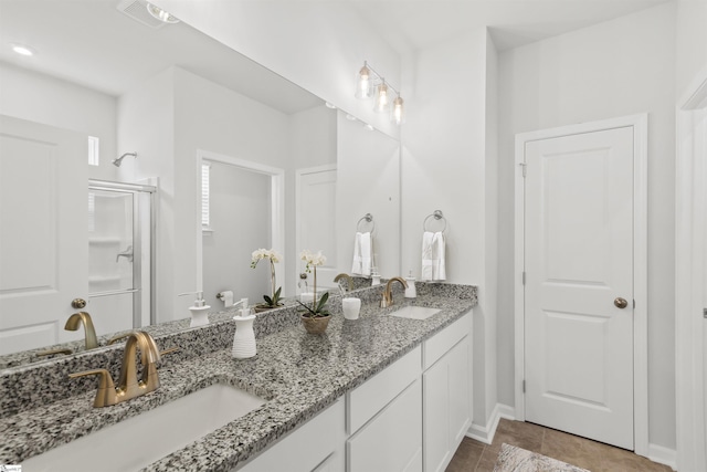 1142 Berry Patch Dr, Lyman, SC 29365 - full bath with double vanity, a shower stall, baseboards, and tile patterned flooring