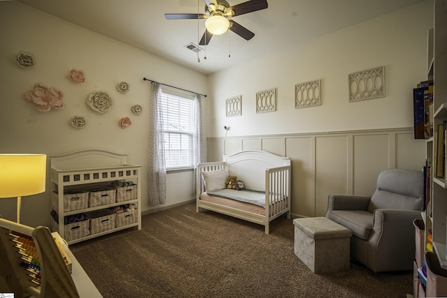 350 Hartleigh Dr, Lyman, SC 29365 - carpeted bedroom with wainscoting, a decorative wall, and a ceiling fan