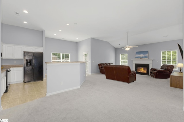 160 Spirit Mountain Ln, Easley, SC 29642 - living room with a ceiling fan, a glass covered fireplace, light colored carpet, plenty of natural light, and recessed lighting