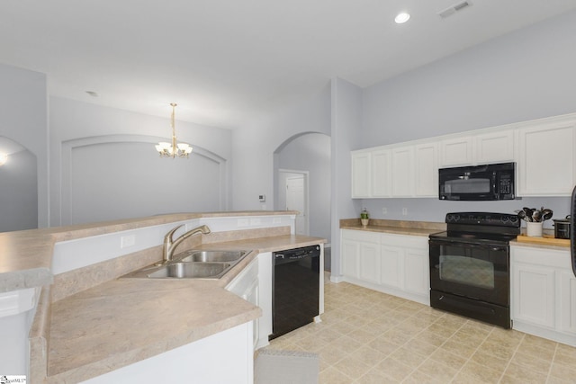160 Spirit Mountain Ln, Easley, SC 29642 - kitchen featuring black appliances, arched walkways, a sink, and white cabinets