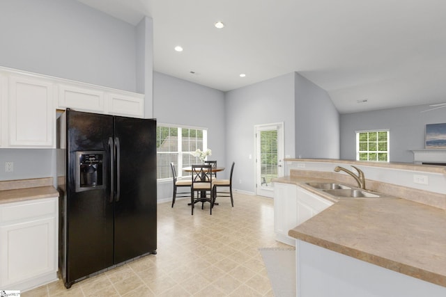 160 Spirit Mountain Ln, Easley, SC 29642 - kitchen with black refrigerator with ice dispenser, a sink, white cabinets, recessed lighting, and light countertops