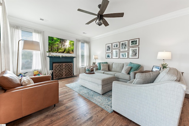 647 Fern Hollow Trl, Anderson, SC 29621 - living area with crown molding, healthy amount of natural light, ceiling fan, and wood finished floors