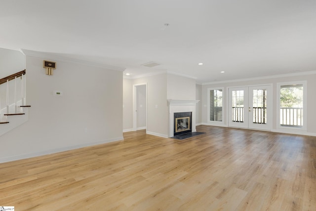 409 Hunters Cir, Greenville, SC 29617 - unfurnished living room featuring stairway, crown molding, light wood-style flooring, recessed lighting, and baseboards