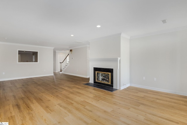 409 Hunters Cir, Greenville, SC 29617 - unfurnished living room with stairs, crown molding, a fireplace with flush hearth, light wood finished floors, and baseboards