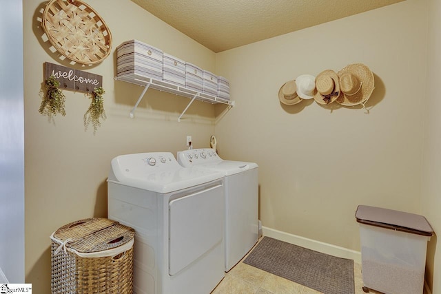 809 Dove Creek Ct, Boiling Springs, SC 29316 - laundry room with washer and clothes dryer, baseboards, and a textured ceiling