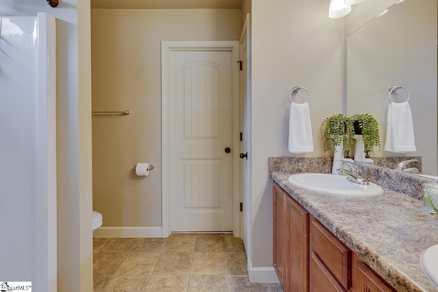 809 Dove Creek Ct, Boiling Springs, SC 29316 - full bathroom with double vanity, toilet, and baseboards