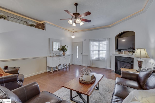 809 Dove Creek Ct, Boiling Springs, SC 29316 - living room featuring ornamental molding, a ceiling fan, wood finished floors, a fireplace, and baseboards