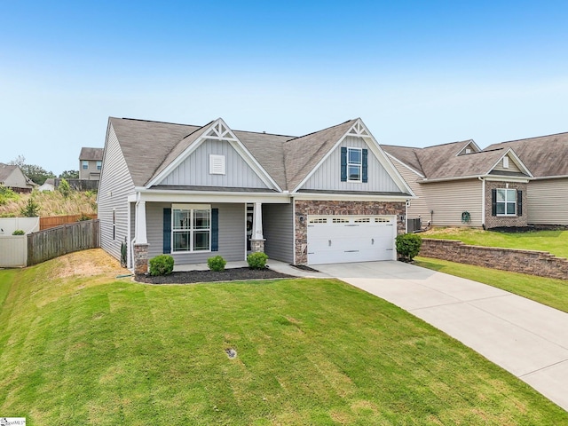 413 Basalt Ct, Powdersville, SC 29642 - craftsman inspired home featuring board and batten siding, concrete driveway, covered porch, an attached garage, and stone siding