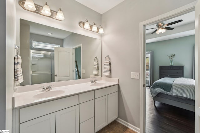 413 Basalt Ct, Powdersville, SC 29642 - ensuite bathroom featuring double vanity, baseboards, a ceiling fan, and a shower with shower door