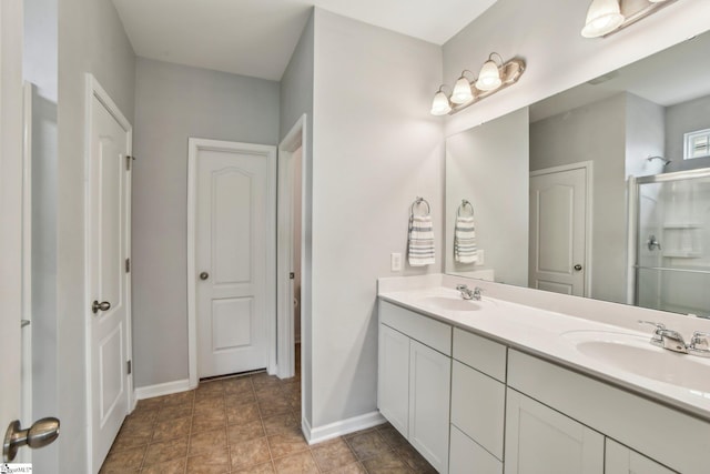 413 Basalt Ct, Powdersville, SC 29642 - bathroom featuring double vanity, baseboards, and a shower stall