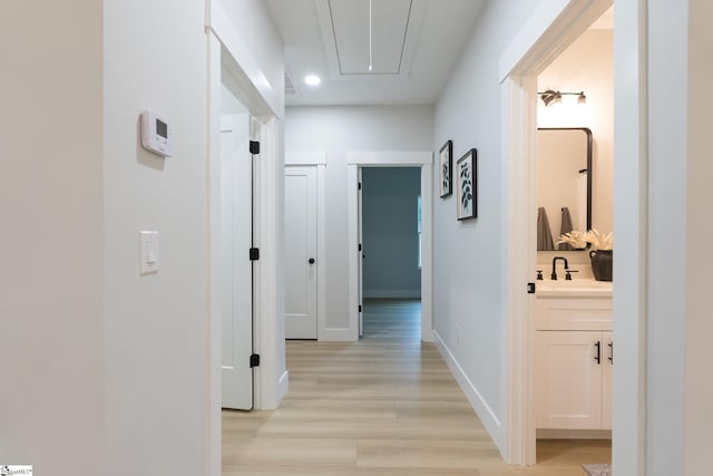 168 Dunbar St, Wellford, SC 29385 - corridor featuring attic access, light wood-style floors, a sink, recessed lighting, and baseboards