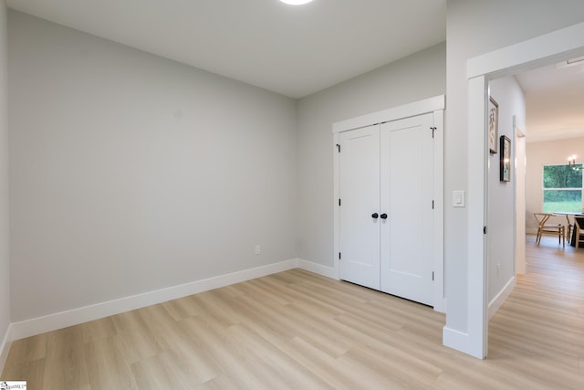 168 Dunbar St, Wellford, SC 29385 - unfurnished bedroom featuring light wood-style floors, baseboards, and a closet
