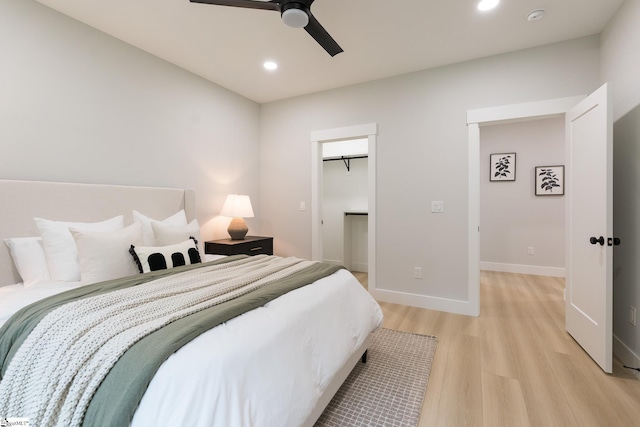 168 Dunbar St, Wellford, SC 29385 - bedroom featuring light wood finished floors, recessed lighting, ceiling fan, baseboards, and a walk in closet