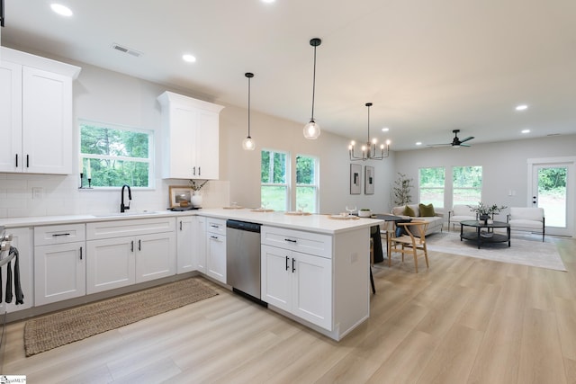 168 Dunbar St, Wellford, SC 29385 - kitchen featuring stainless steel dishwasher, a sink, light wood-style floors, open floor plan, and a peninsula