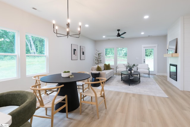 168 Dunbar St, Wellford, SC 29385 - dining space featuring light wood finished floors, recessed lighting, a fireplace, ceiling fan, and a chandelier