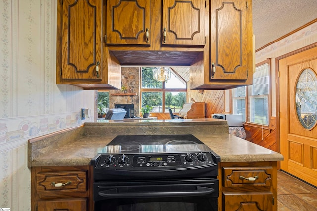 280 Kari Dr, Westminster, SC 29693 - kitchen featuring black electric range oven, brown cabinets, crown molding, wallpapered walls, and a textured ceiling
