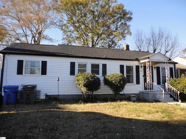 405 Perry Rd, Greenville, SC 29609 - view of front of house with a front yard and a chimney