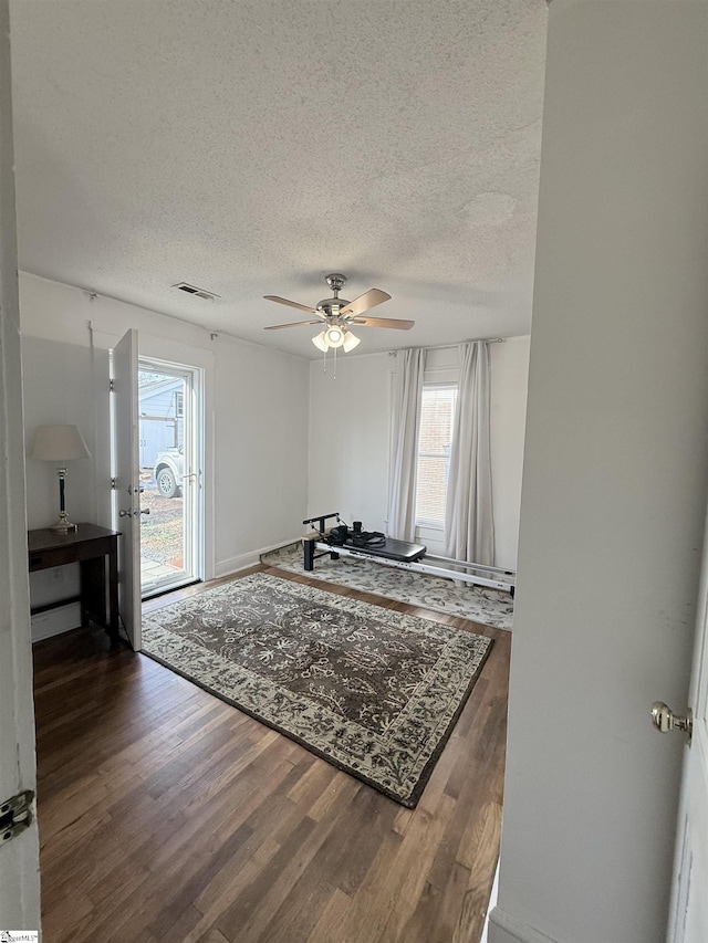 405 Perry Rd, Greenville, SC 29609 - living room featuring wood finished floors, a textured ceiling, and a ceiling fan