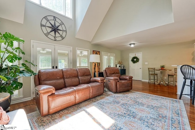 182 Roundstone Dr, Inman, SC 29349 - living area with french doors, a towering ceiling, wood finished floors, a ceiling fan, and baseboards