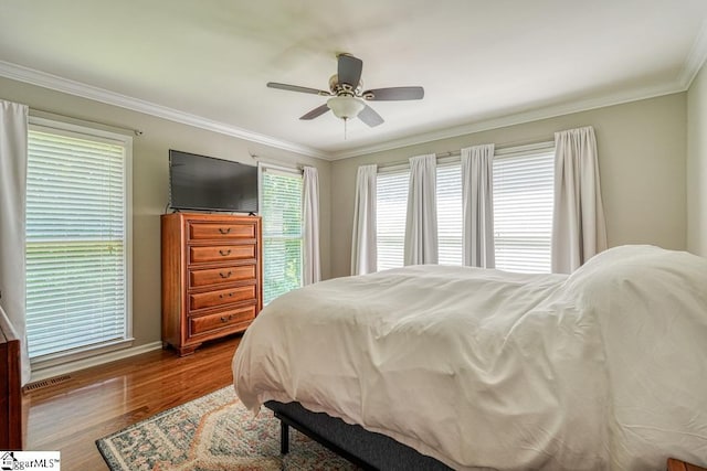 182 Roundstone Dr, Inman, SC 29349 - bedroom with wood finished floors, crown molding, a ceiling fan, and baseboards