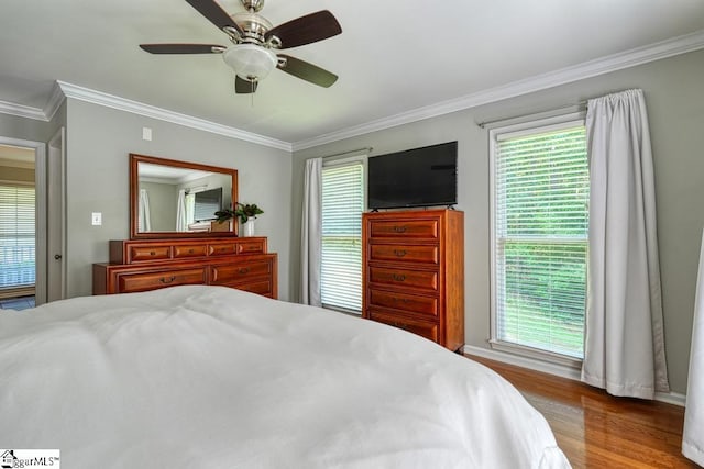 182 Roundstone Dr, Inman, SC 29349 - bedroom with ornamental molding, multiple windows, wood finished floors, a ceiling fan, and baseboards