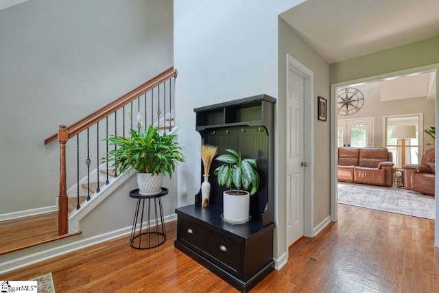 182 Roundstone Dr, Inman, SC 29349 - hallway with wood finished floors, stairway, and baseboards