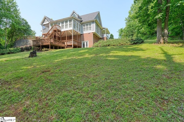182 Roundstone Dr, Inman, SC 29349 - rear view of property with a yard, a sunroom, a deck, and brick siding