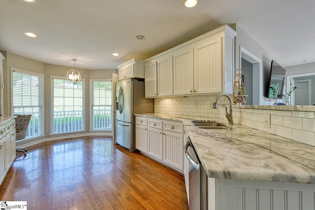 182 Roundstone Dr, Inman, SC 29349 - kitchen featuring stainless steel appliances, a sink, decorative backsplash, recessed lighting, and white cabinetry