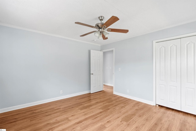 209 Boyd Ave, Simpsonville, SC 29681 - unfurnished bedroom with ornamental molding, light wood-style flooring, a closet, baseboards, and a ceiling fan