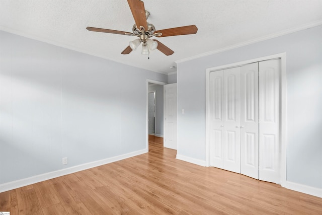209 Boyd Ave, Simpsonville, SC 29681 - unfurnished bedroom featuring ornamental molding, light wood-type flooring, baseboards, a closet, and a ceiling fan