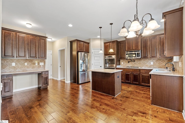 135 Adams Creek Pl, Simpsonville, SC 29681 - kitchen featuring appliances with stainless steel finishes, a sink, decorative backsplash, a center island, and a chandelier