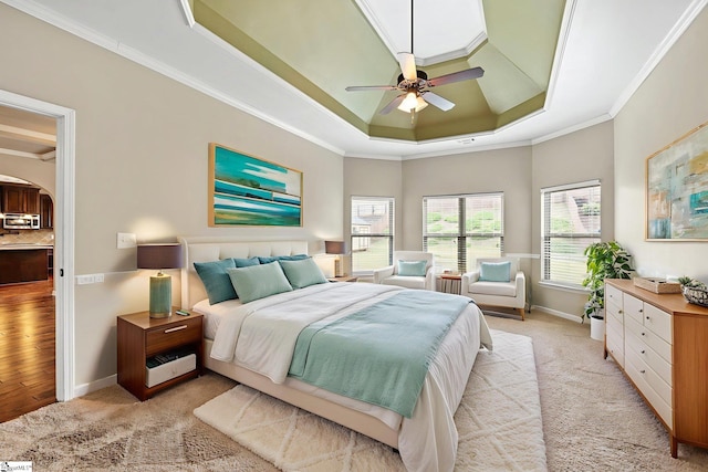 135 Adams Creek Pl, Simpsonville, SC 29681 - bedroom with a tray ceiling, crown molding, arched walkways, baseboards, and light carpet