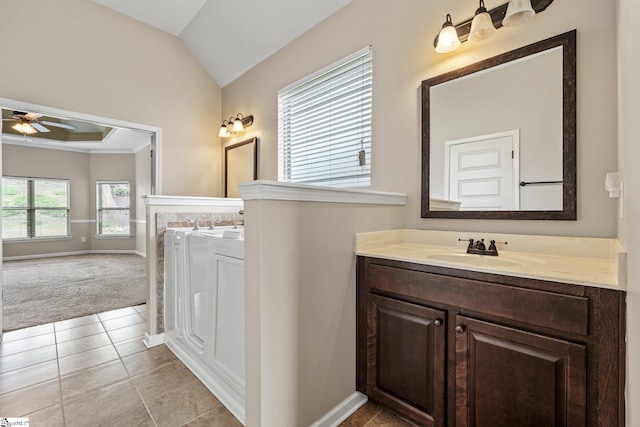 135 Adams Creek Pl, Simpsonville, SC 29681 - full bath with two vanities, a ceiling fan, lofted ceiling, tile patterned floors, and baseboards
